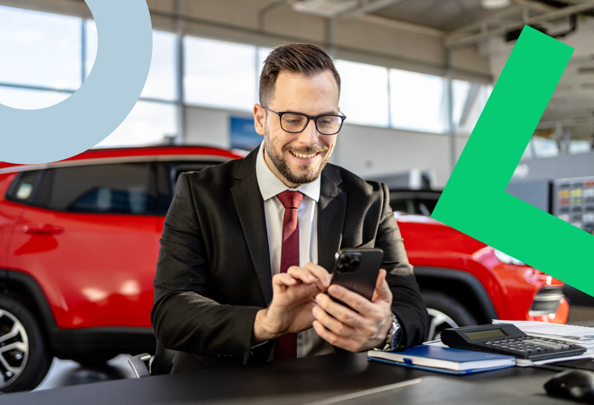 Car salesman using GoTo Connect to effectively communicate with customers.