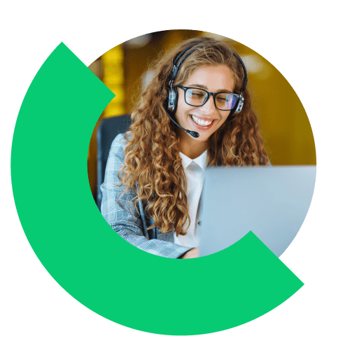 Person in office using business communication software on a laptop.