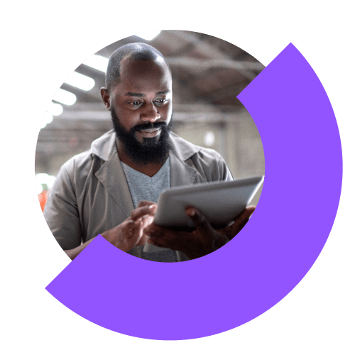 Person in factory using remote access and support tools on a tablet.