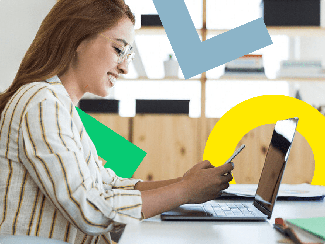 A woman smiling while setting up call forwarding on her mobile phone.